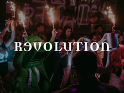 A group of people with spirits in buckets of ice with sparklers at Revolution