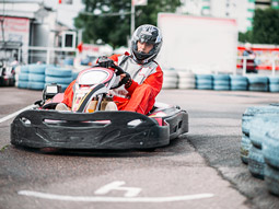 Someone on a go kart going around a track in Madrid