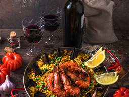 A spanish meal on a table with wine at a stag dinner in Madrid