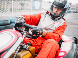 Someone in a go kart driving around a track in Lisbon