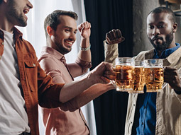 A group of people clinking their pints of beers at Beerfest in Madrid