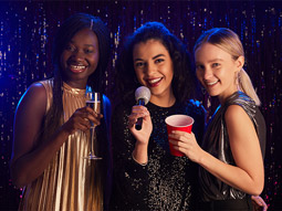 A group of hens having a fun time at a karaoke party in Magaluf