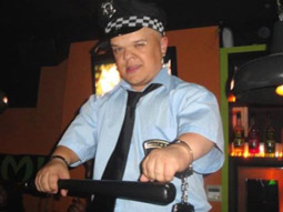 A dwarf dressed in a police outfit in Barcelona