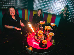 A group of people enjoying drinks at Vinyl in Cambridge