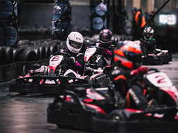 People racing on the track at Team Sport Karting in Newcastle