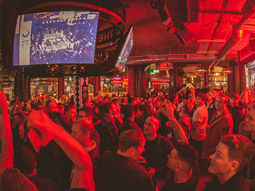 A crowd of people socialising at Box