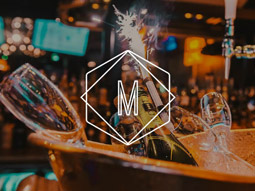 A bucket of ice with champagne, glasses and sparklers in at Manahatta