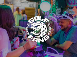 A group of people enjoying food and drinks at Big Fang Crazy Golf