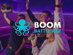 Three people singing at Boom Battle Bar Karaoke
