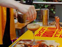 Image of cocktails being made and poured through a cocktail shaker