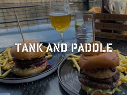 Two burger meals with a glass of beer beside it at Tank and Paddle in York