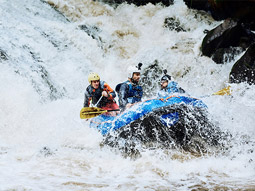 A group of people paddling through water in Split