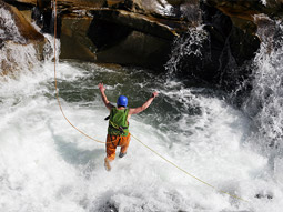 Someone jumping into water as part of a canyoning activity in Split