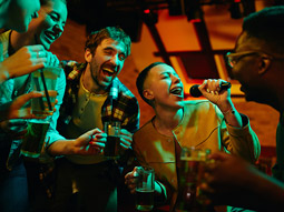 A group of people singing karaoke in Lisbon