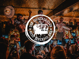 People dancing on the bar at The Cocktail Club