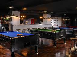 A row of pool tables at Buskers On The Ball