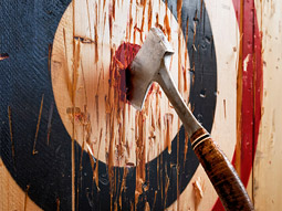An axe in a wooden target 