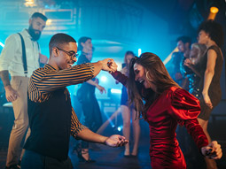 A woman trying to salsa dance with her dance partner