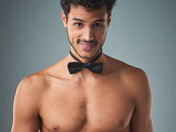 A topless cheeky butler wearing a bowtie