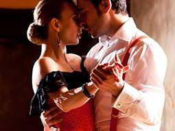 Close up of a man and woman intimately salsa dancing