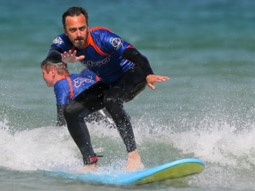 A man riding on a massive wave