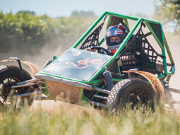 A rage buggy in a muddy field