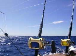 Fishing equipment on a boat to a backdrop of the sea