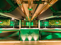 An empty, green bar in the Heineken factory