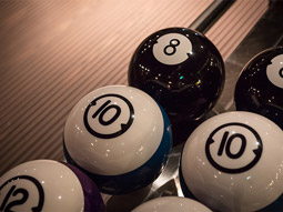 A close up shot of some bowling balls at Lane 7
