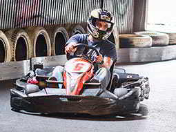 A stag driving around a go karting track in Krakow