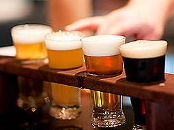 Four craft beers in a rack