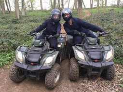 Some quad bikes driving through the forest 