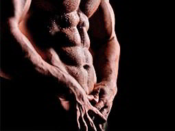 The wet torso of a topless man