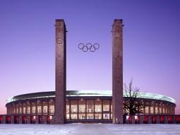 The front of the Olympic Stadium, Berlin, with the Olympic logo between two towers