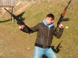 Brunette woman looking down the sights of a rifle