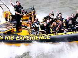 People in a speedboat on the River Thames