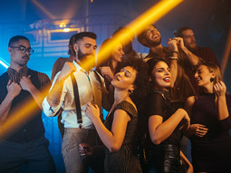 A woman hooking her red thong with her red heels