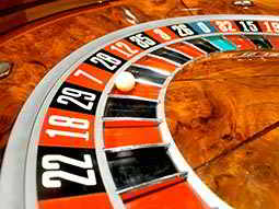A white ball in red seven on a roulette wheel