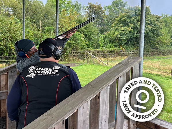 Someone aiming at a clay pigeon