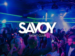 A busy club with lots of people dancing inside