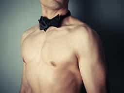 A semi-naked man in a black bowtie