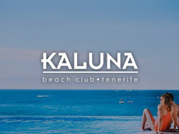 Someone looking out at the sea from the pool at Kaluna Beach Club