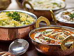 Curry dishes in rose gold bowls