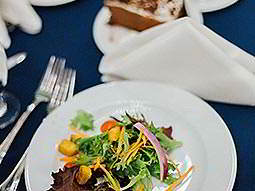 A small plate of food on a blue tablecloth