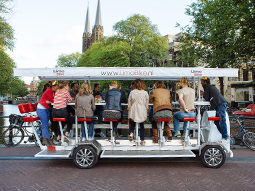 A group of women on a prosecco bike in Amsterdam