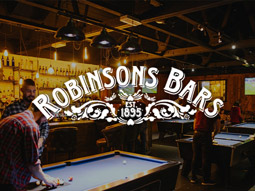 People playing pool with the Robinsons logo overlayed 