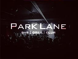 Faded dark image of people in a club