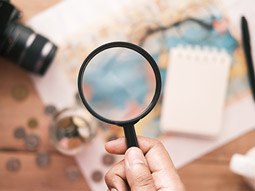 A magnifying glass lying out on a book