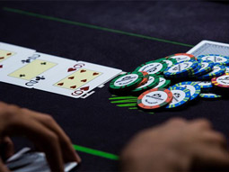 Some playing cards and counters on a table in a casino in Benidorm