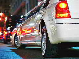The exterior of a white stretch limousine